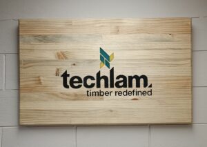 Company sign in wood, glulam pine, resin inlay